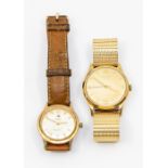 A gents vintage Longines 9ct gold wristwatch, round dial with applied gilt number and arrow markers,