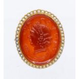 A Victorian carnelian and seed pearl carved cameo brooch depicting Demeter goddess of harvest,