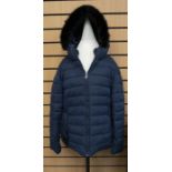 A navy puffer waist length Jaeger jacket with a fake black fur collar with hood. Size 16. It has a