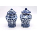 Pair of 20th Century Chinese blue and white covered vases, height approx 20cm, repaired chip to rim