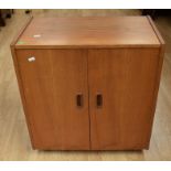 A teak 1970s music cabinet with LP rack to inside, retro in style with wooden finger handles