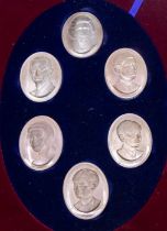A Modern limited edition Royal Family silver portrait medallion boxed set to include: HM The
