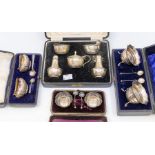 Four various boxed silver cruet sets to include: 1. late Victorian pair of oval gadrooned salts,