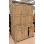 A 19th Century pitch pine kitchen cupboard, having two cupboard doors above two bottom cupboard