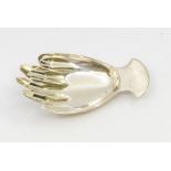 A George III silver caddy spoon in the form of a right hand, plain handle, hallmarked by JS (John