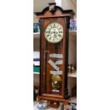 A Vienna wall clock with 7" 2 piece dial, with two train 8 day weight driven movement, subsidiary