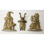 Brass Punch & Judy door stops, along with brass boot pull