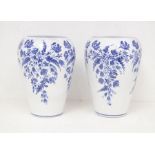Denby: a pair of hand painted vases with blue floral decoration on a white body, height approx 30.
