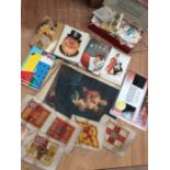 Collection of postcards, tin of stamps and silk cigarette cards.