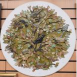 A large studio pottery plaque of birds in foliage signed Williamson, diameter 70cm, along with an
