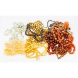 A collection of bead necklaces to include tigers eye, carnelian, plastic and bone etc various