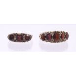 Two garnet and 9ct gold dress rings both set with oval garnets and scroll decoration, sizes J1/2,