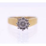 A diamond and 18ct gold solitaire, the round brilliant cut diamond illusion set, weighing approx 0.