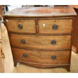 George III bow front chest of two above two drawers, in mahogany