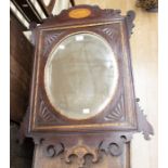 Early- to mid-19th century bevelled oval mirror within carved mahogany frame having gilded detail