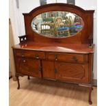 A late Victorian mahogany sideboard having a central oval mirror to upper section, with two