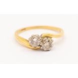 An 18ct gold and diamond 'toi-et-moi' ring, total diamond weight approx 0.40ct, size K1/2, total