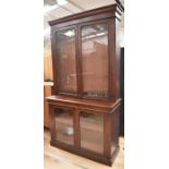 A tall mahogany Victorian display cabinet having top glazed unit with shelves above glazed base with