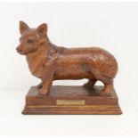 A Modern carved oak figure of a Corgi on raised plinth, brass plaque titled: Marapen Gladiator,