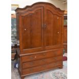 A large oak Continental 19th Century linen cupboard, with three drawers to base, pull out sheet