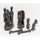 A group of carved African probably Kenyan hardwood figures to include: three fishermen with two