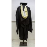 A boxed Ede & Ravenscroft Ltd graduate gown and mortar hat