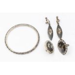 A collection of Siam silver jewellery to include a ring (modified) a single earring and a pair of