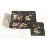 Four early 20th century black lacquered boxes with flower detail, and a collection of costume