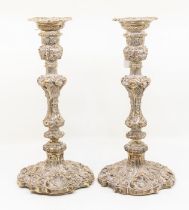 A pair of Edwardian silver large candlesticks, detachable sconces, urn shaped sockets above