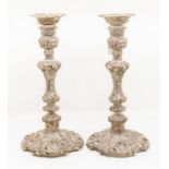 A pair of Edwardian silver large candlesticks, detachable sconces, urn shaped sockets above