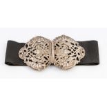 A late Victorian silver Nurse's belt buckle, the clasp cast in the Renaissance manner with central