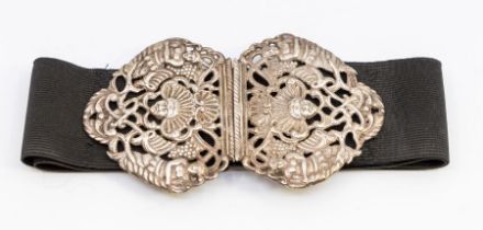 A late Victorian silver Nurse's belt buckle, the clasp cast in the Renaissance manner with central