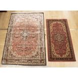 20th century silk rug blue and pink ground 110 x 168cm along with 20th century red ground machined