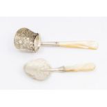 A William IV silver caddy shovel, mother-of-pearl handle, the body chased with flowers and