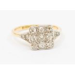 An Edwardian diamond and 18ct gold cluster ring, square top platinum set with three rows of