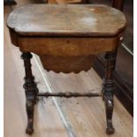 A late Victorian walnut sewing table on castors, along with a 19th Century folding card table in