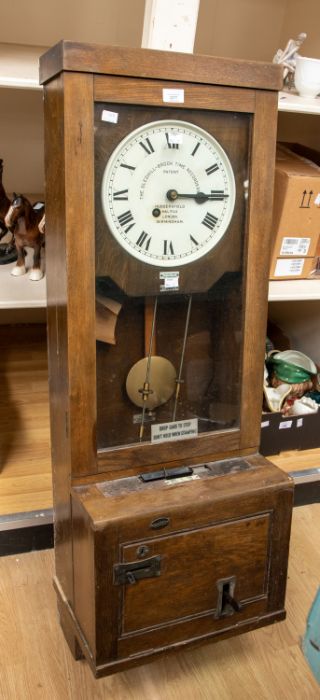 An early 20th Century Gledhill Brook time recorder/clocking in machine, oak cased, number 14670/