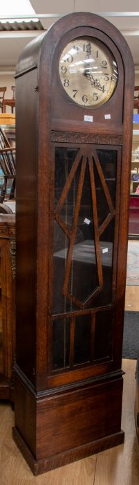 A 1930's Art Deco grandmother clock, arched shaped with Deco detail, Arabic numerals