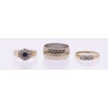 A diamond set three stone 9ct gold ring, set with three round brilliant cut diamonds, total