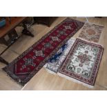 Four rugs/mats silk and wool continental made blue & red ground along with red ground runner.