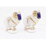 Two Royal Crown Derby Ram paperweights, gold stopper