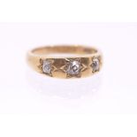 An early 20th century diamond and 18ct gold ring, comprising three old cut diamonds star set,