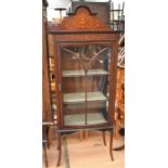 A Edwardian glazed display cabinet in mahogany with inlaid detail, on splayed legs, having two