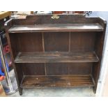 A mid 20th Century darkwood three shelf bookcase along with a mid 20th Century French style lounge