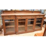 Long mahogany glazed book/display cabinet with floor glazed doors to reveal three internal