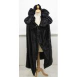 A late Edwardian style opera cape, the high stand up collar is padded and ruched, the top of the