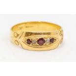 A Victorian ruby and diamond 18ct gold ring, scrolled shoulders, size M1/2, total gross weight