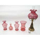 Five pieces of Mary Gregory cranberry glass including lamp