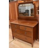 An Edwardian three piece suite comprising wardrobe, chest of drawers and dressing table, all with