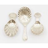 Three various late 19th/early 20th Century silver shell shaped caddy spoons comprising:  1. one with